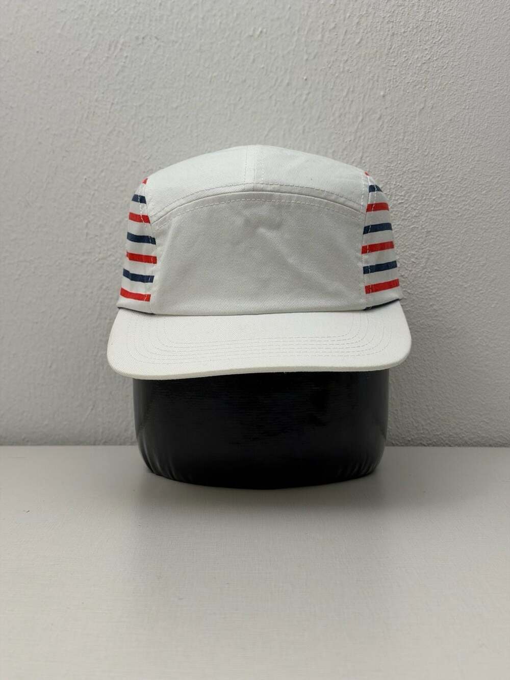 Undefeated 5-Panel Camp Hat with Red and Blue Striped Accents